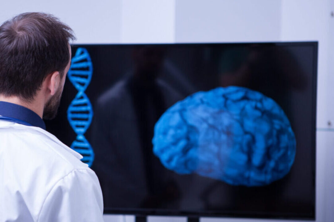 Young Brain surgeon lookin a this patient brain aftter the surgery. Doctor using moder technology from the hospital.